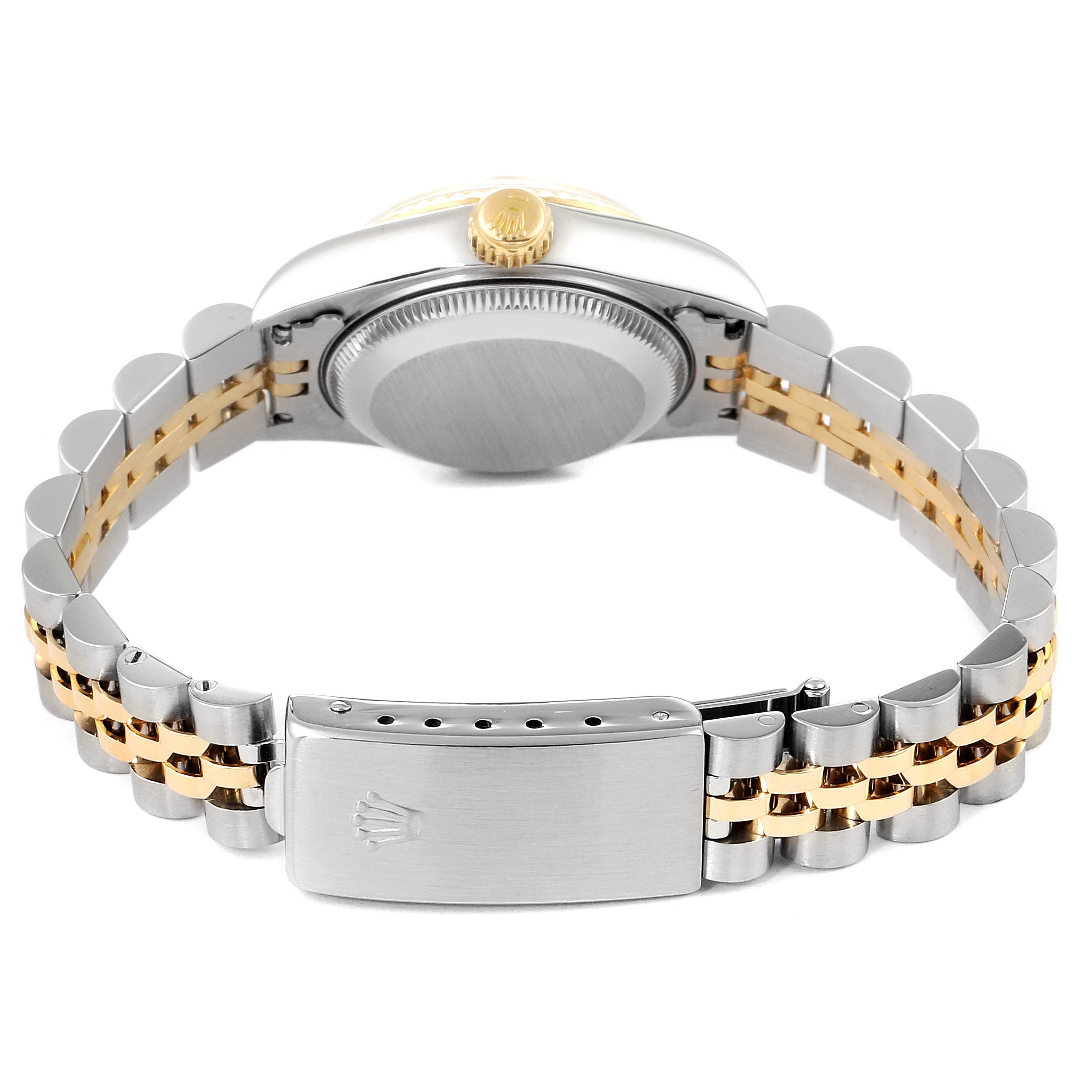 The image shows the back view of a Rolex Datejust 69173 Women
s Steel and Gold (two tone) Champagne Dial 69173 Women
s Steel and Gold (two tone) Champagne Dial watch, highlighting the case back, crown, and two-tone bracelet with clasp.