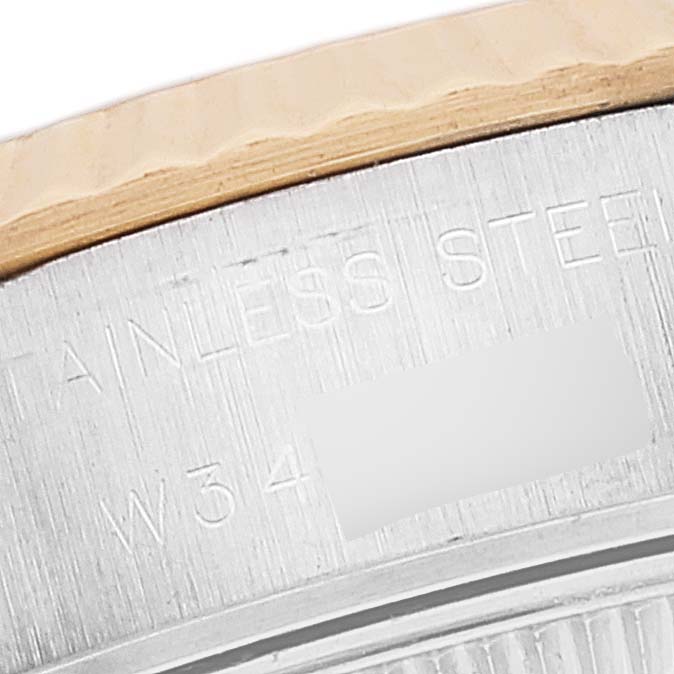 The image shows a close-up of the case back of a Rolex Datejust 69173 Women's Steel and Gold (two tone) White Dial 69173 Women's Steel and Gold (two tone) White Dial, with "STAINLESS STEEL" engraved on it.