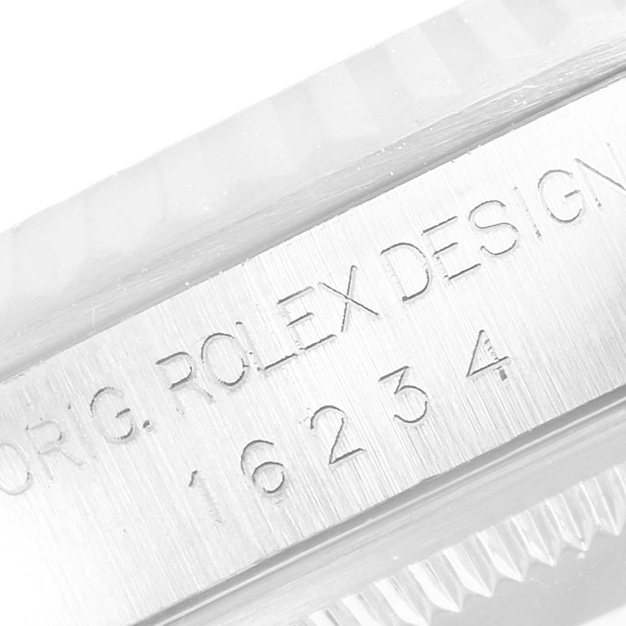 This is a close-up image showing the engraved inner bezel of a Rolex Datejust 16234 Men
s Stainless Steel Blue Dial 16234 Men
s Stainless Steel Blue Dial watch.