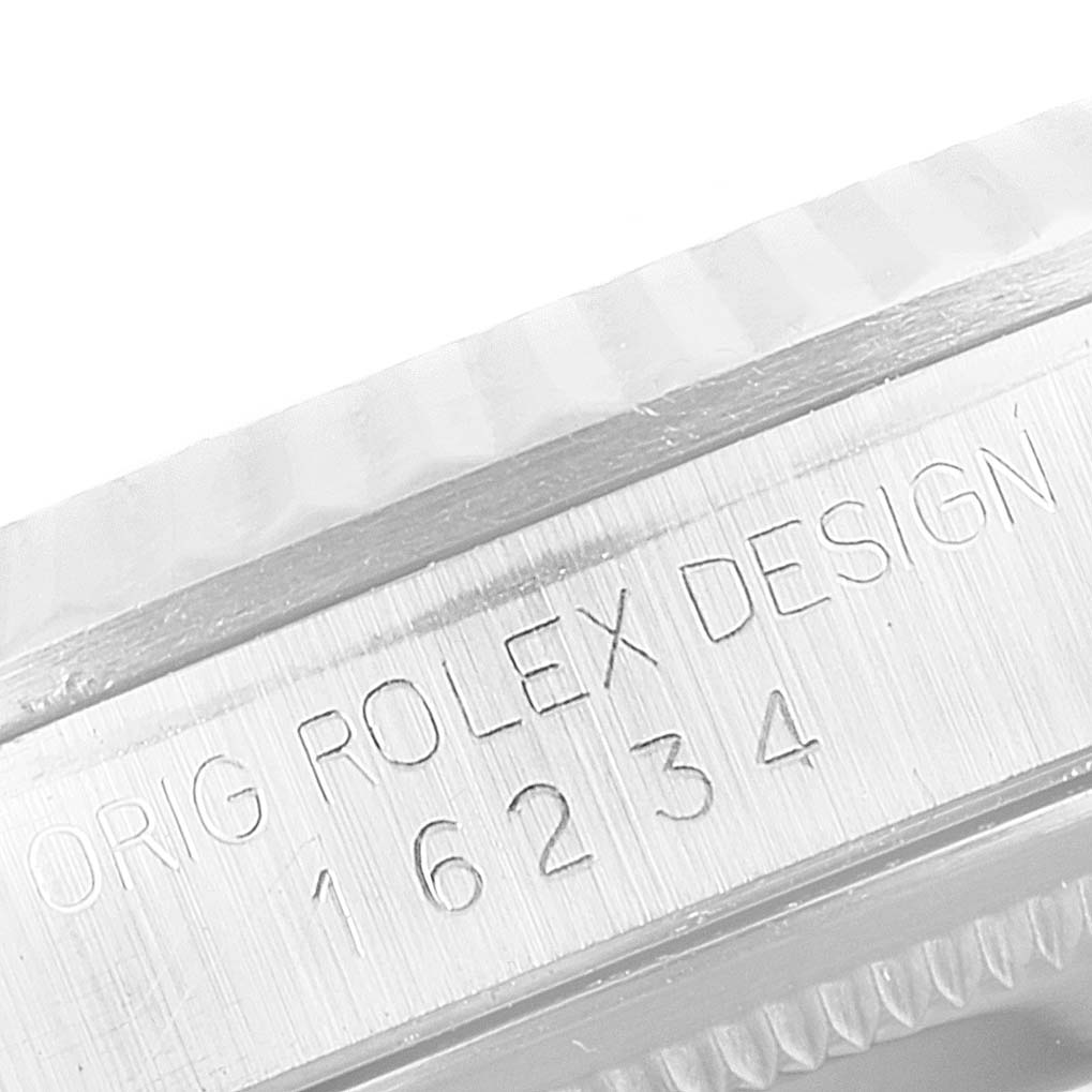 The image shows a close-up of the side engraving on a Rolex Datejust 16234 Men
s Stainless Steel White Dial 16234 Men
s Stainless Steel White Dial model, displaying the original design number "16234."
