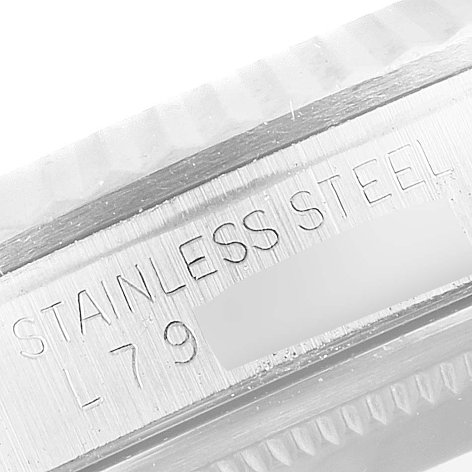 The image shows a close-up angle of the side of the Rolex Datejust 16234 Men
s Stainless Steel White Dial 16234 Men
s Stainless Steel White Dial, displaying the "STAINLESS STEEL" engraving.