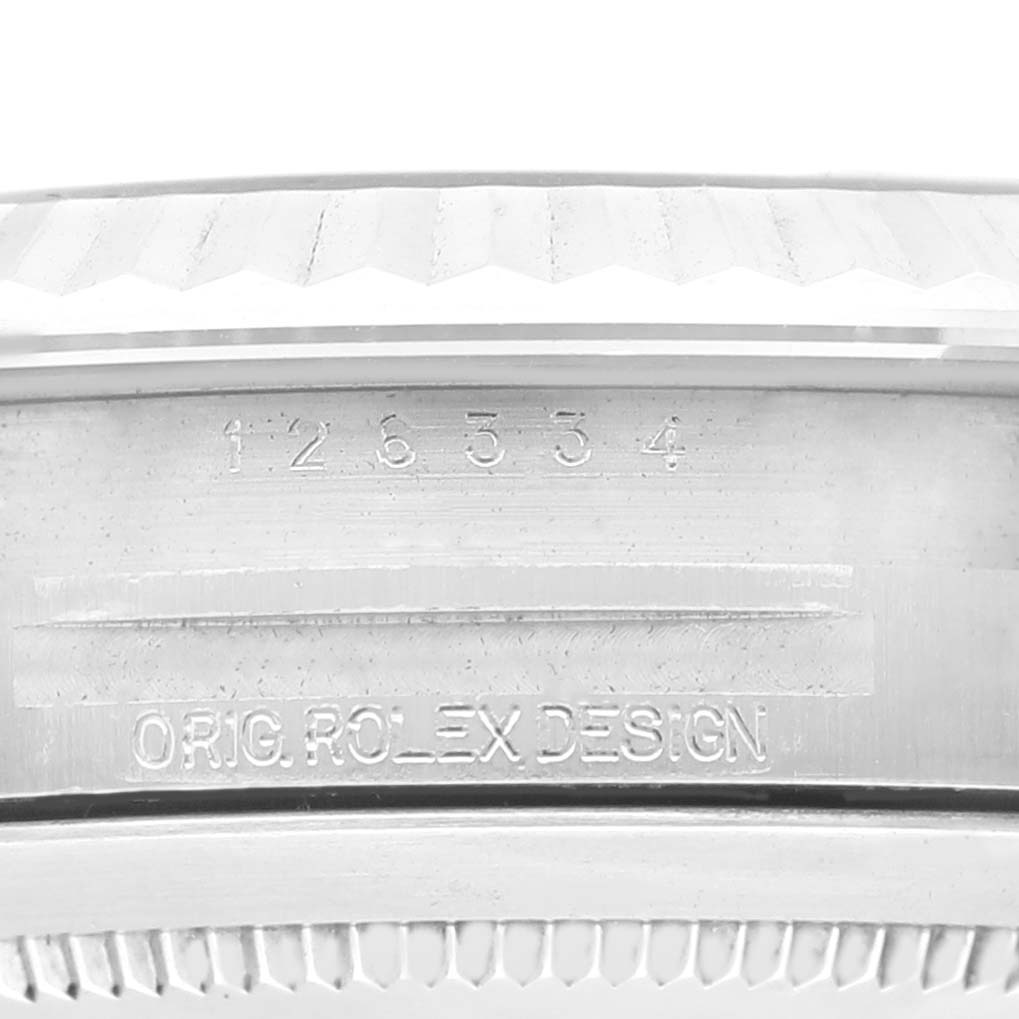 The image shows a close-up angle of the side of the Rolex Datejust 41 126334 Men
s Stainless Steel Blue Dial 126334 Men
s Stainless Steel Blue Dial model, highlighting the engraved serial number and "ORIG. ROLEX DESIGN" text.