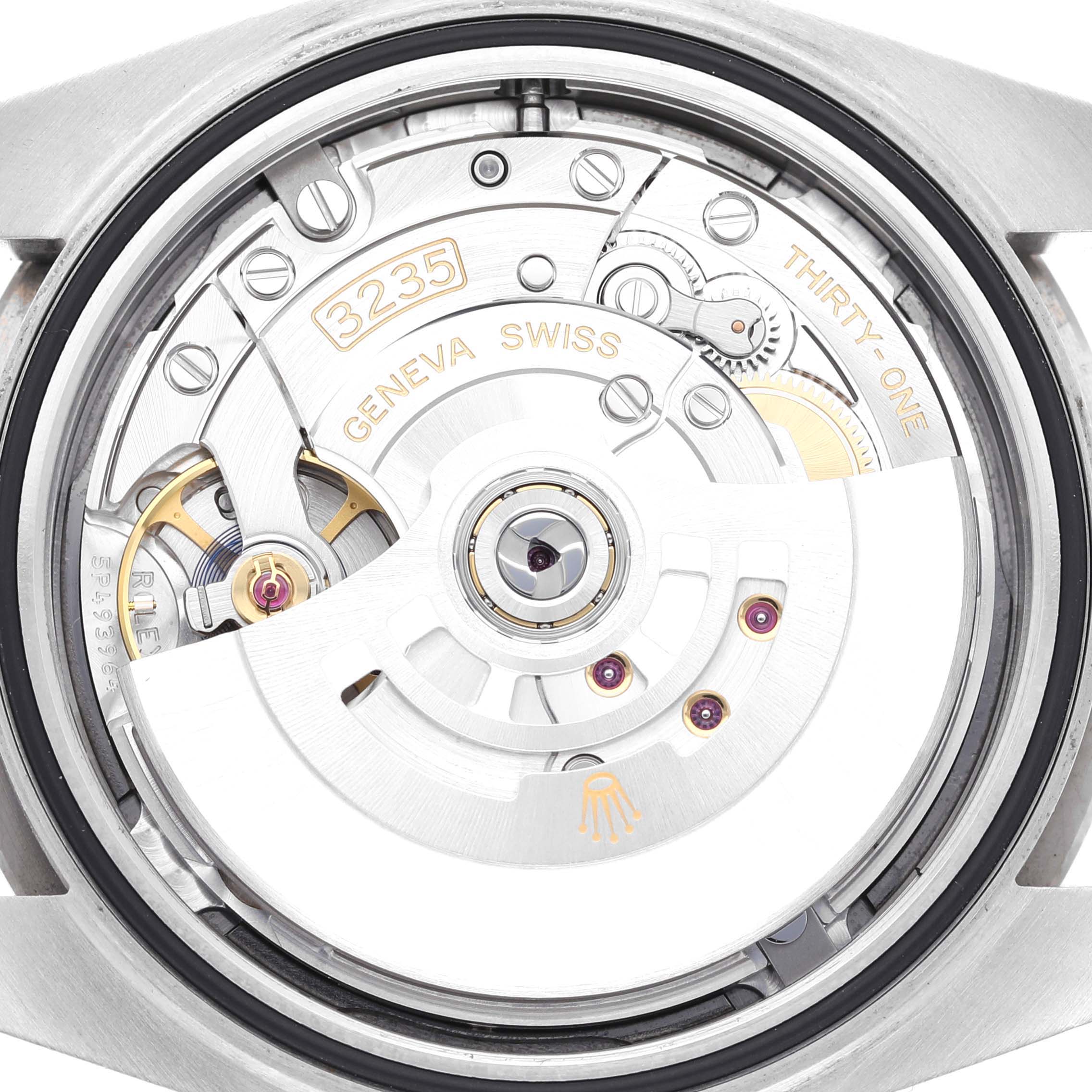 The image shows the movement mechanism of a Rolex Datejust 41 126334 Men
s Stainless Steel Blue Dial 126334 Men
s Stainless Steel Blue Dial watch from a rear angle.