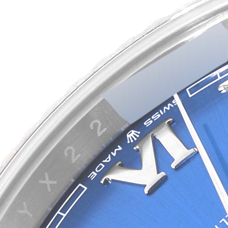 The image shows a close-up of the dial and part of the bezel of a Rolex Datejust 41 126334 Men
s Stainless Steel Blue Dial 126334 Men
s Stainless Steel Blue Dial, featuring the 
Swiss Made
 text and Roman numerals.