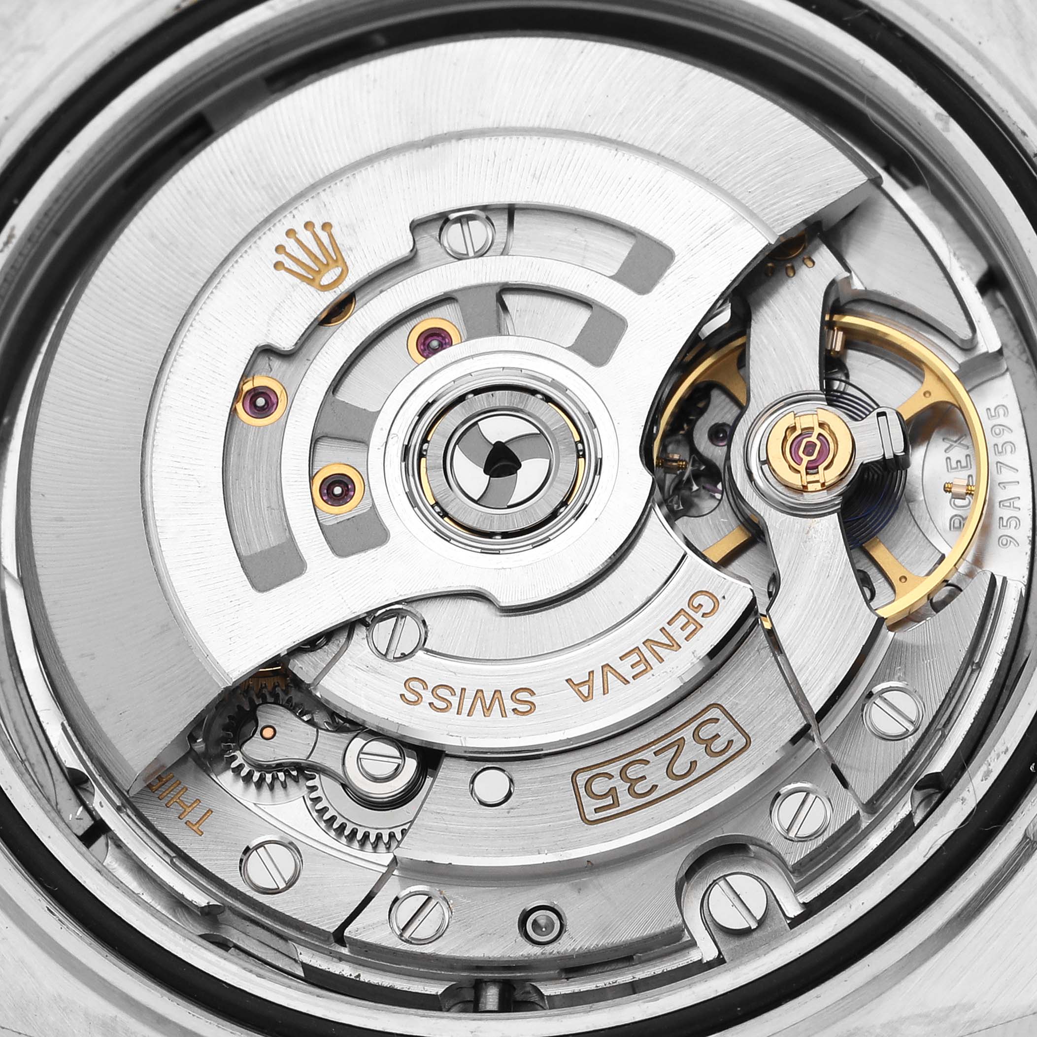This image shows a close-up view of the movement mechanism inside a Rolex Datejust 41 126334 Men
s Stainless Steel Grey Dial 126334 Men
s Stainless Steel Grey Dial watch, revealing gears and intricate parts.