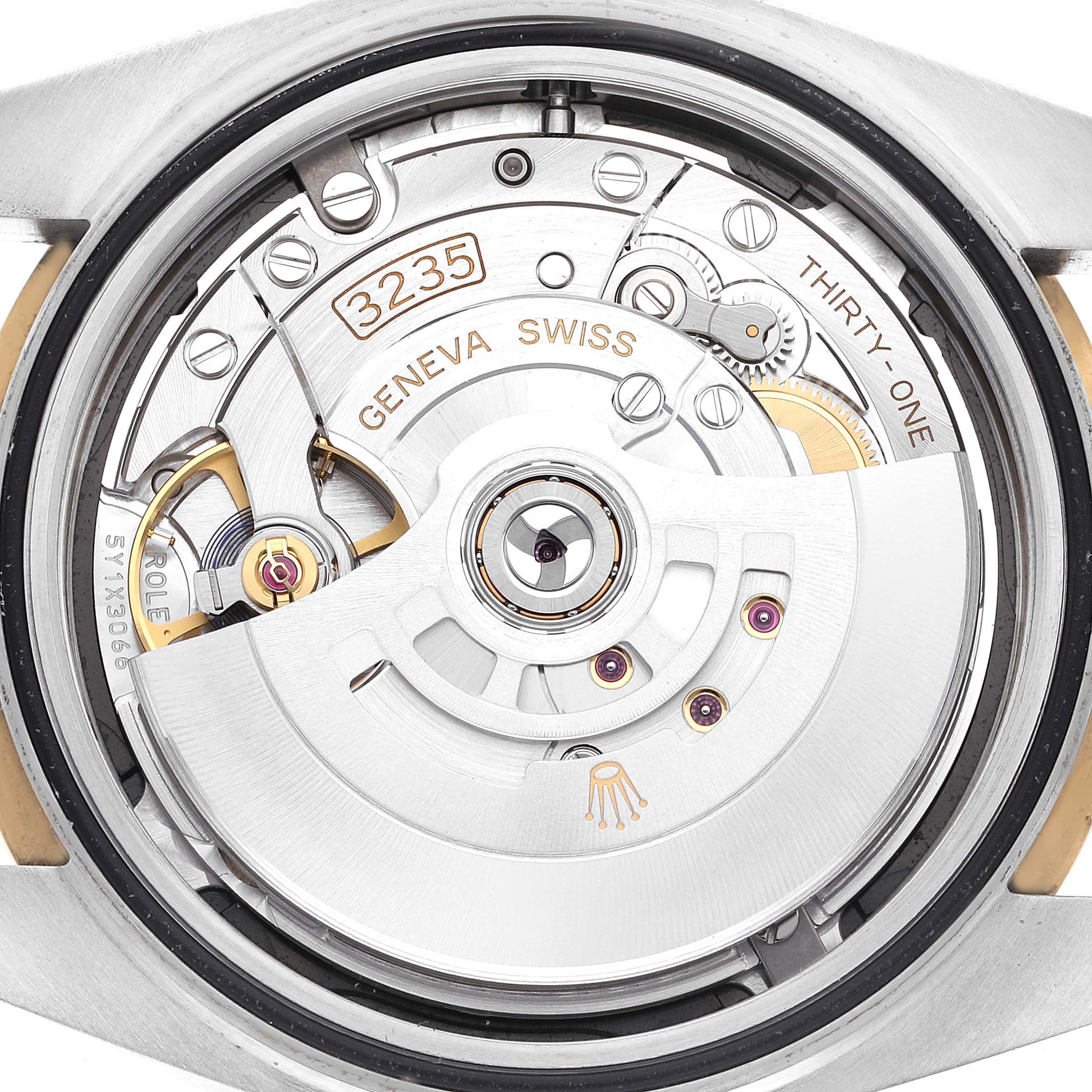 This image displays the movement mechanism of a Rolex Datejust 41 126333 Men's Steel and Gold (two tone) Black Dial 126333 Men's Steel and Gold (two tone) Black Dial watch from a rear angle.