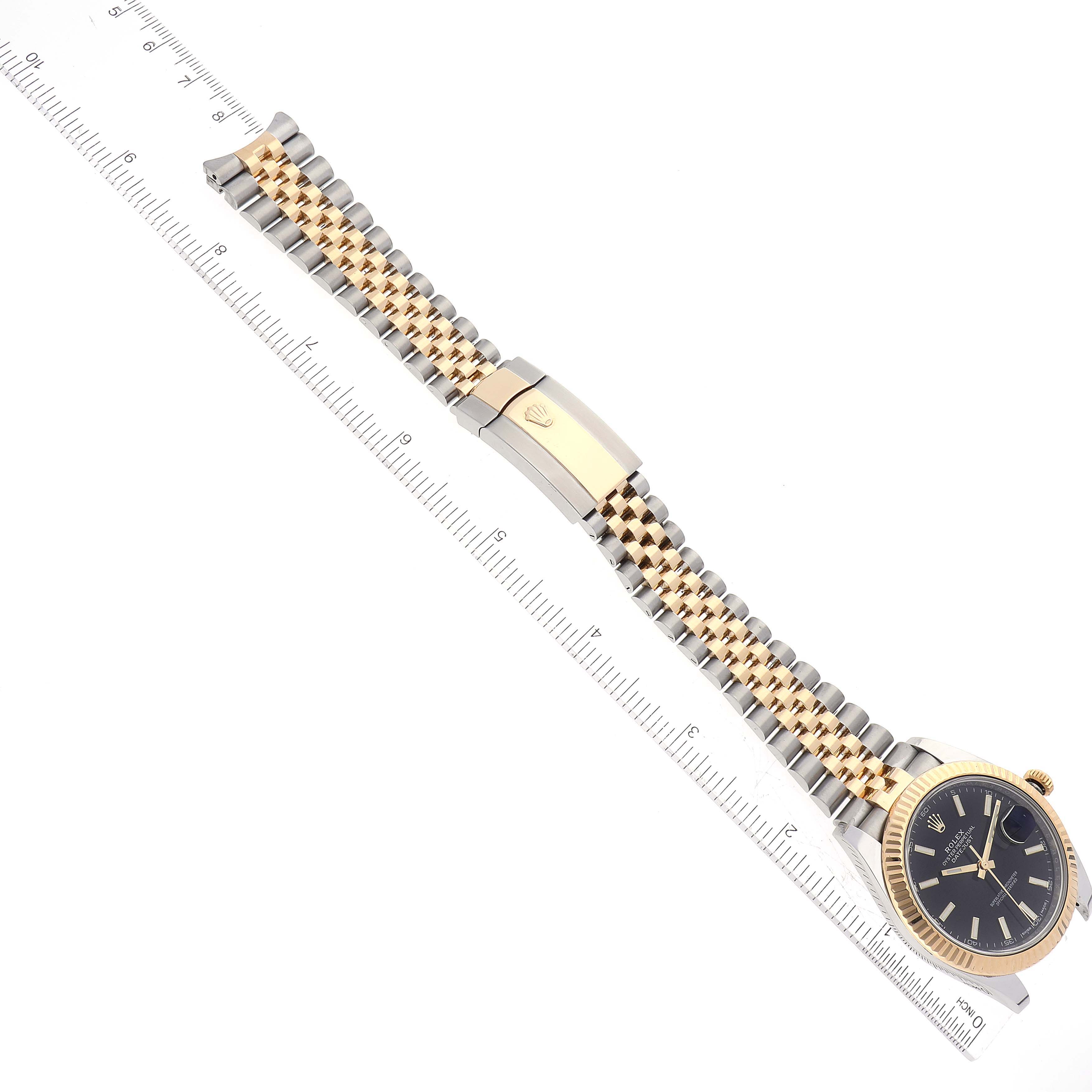 The image shows a Rolex Datejust 41 126333 Men's Steel and Gold (two tone) Black Dial 126333 Men's Steel and Gold (two tone) Black Dial watch in a flat horizontal position with the bracelet extended and a ruler alongside for scale.