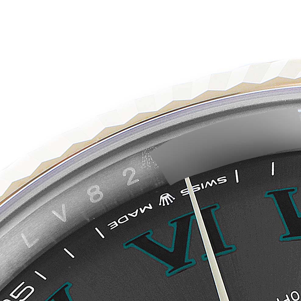 This close-up image shows the bezel, chapter ring, and part of the dial of the Rolex Datejust 41 126333 Men's Steel and Gold (two tone) Grey Dial 126333 Men's Steel and Gold (two tone) Grey Dial.