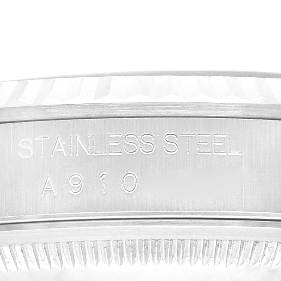 This close-up image shows the side engraving on the case of the Rolex Datejust 16234 Men's Stainless Steel Blue Dial 16234 Men's Stainless Steel Blue Dial watch, specifying "STAINLESS STEEL" and a serial number.