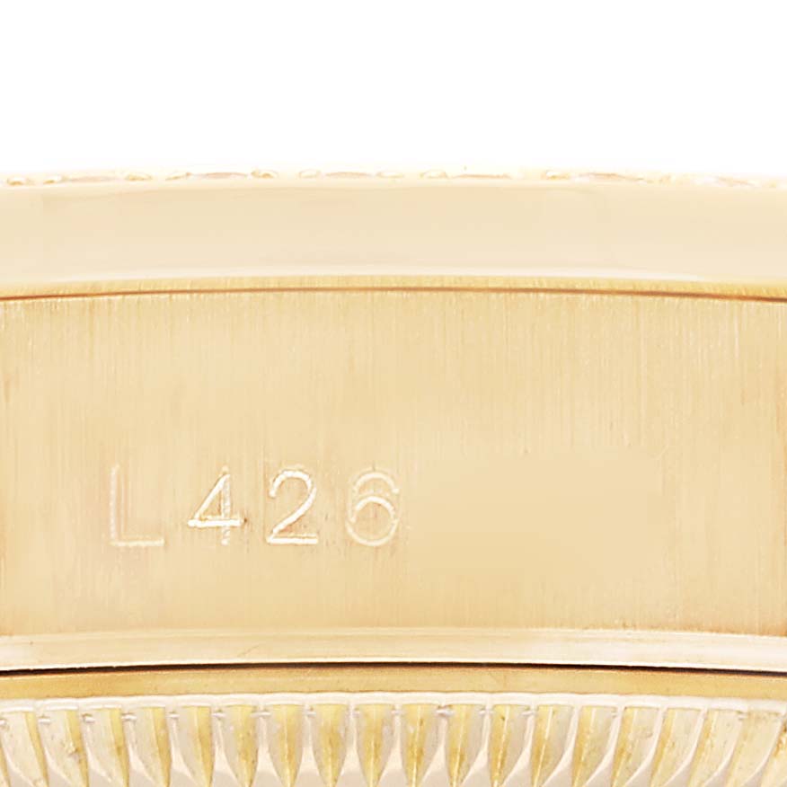 This is a close-up of the engraved inner case back of a Rolex President 69158 Women
s Yellow Gold Champagne Dial 69158 Women
s Yellow Gold Champagne Dial model watch.