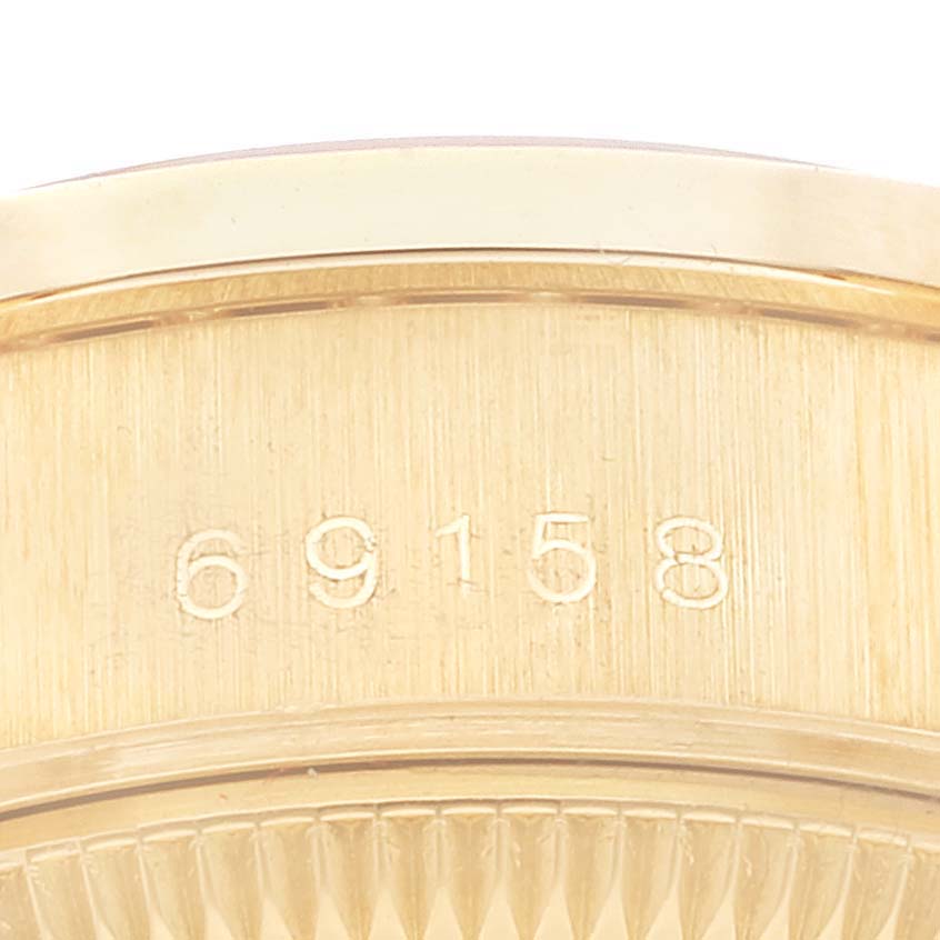 This close-up image shows the engraved model number on the side of a Rolex President 69158 Women
s Yellow Gold Champagne Dial 69158 Women
s Yellow Gold Champagne Dial watch.