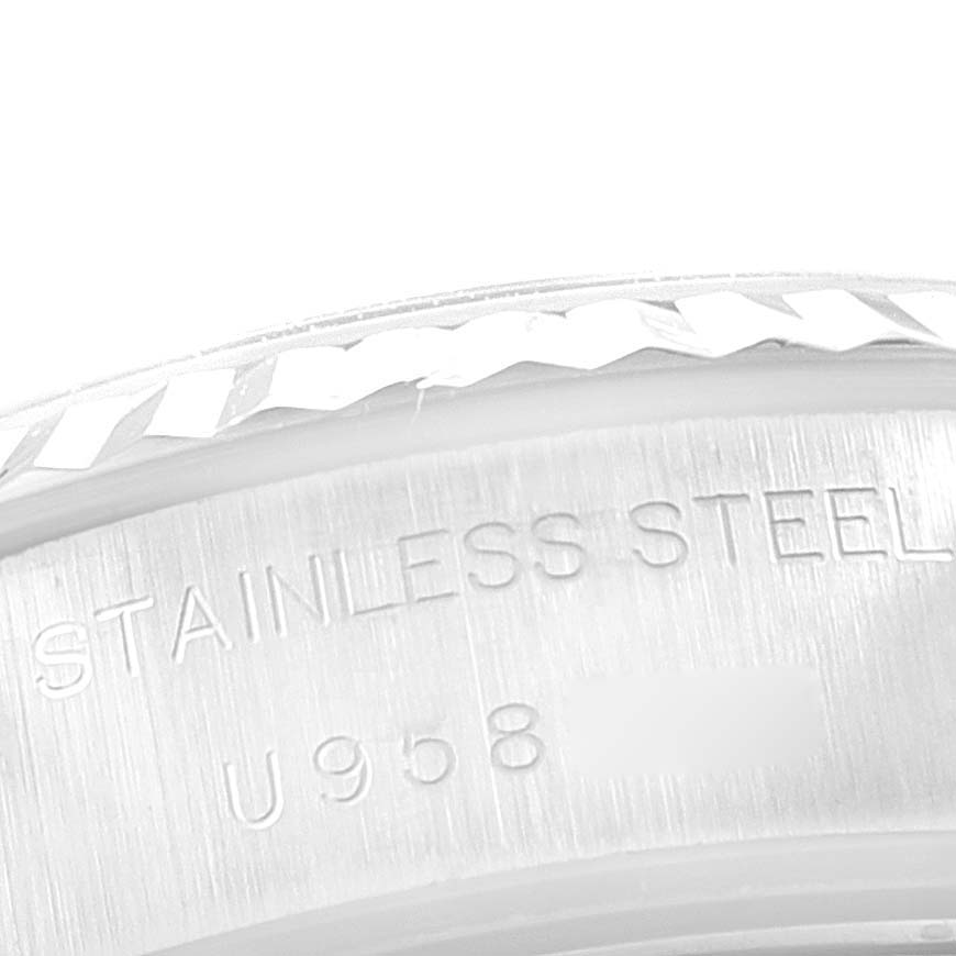 The image shows a close-up of the stainless steel bezel and engraving on a Rolex Datejust 69174 Women
s Stainless Steel Silver Dial 69174 Women
s Stainless Steel Silver Dial watch.