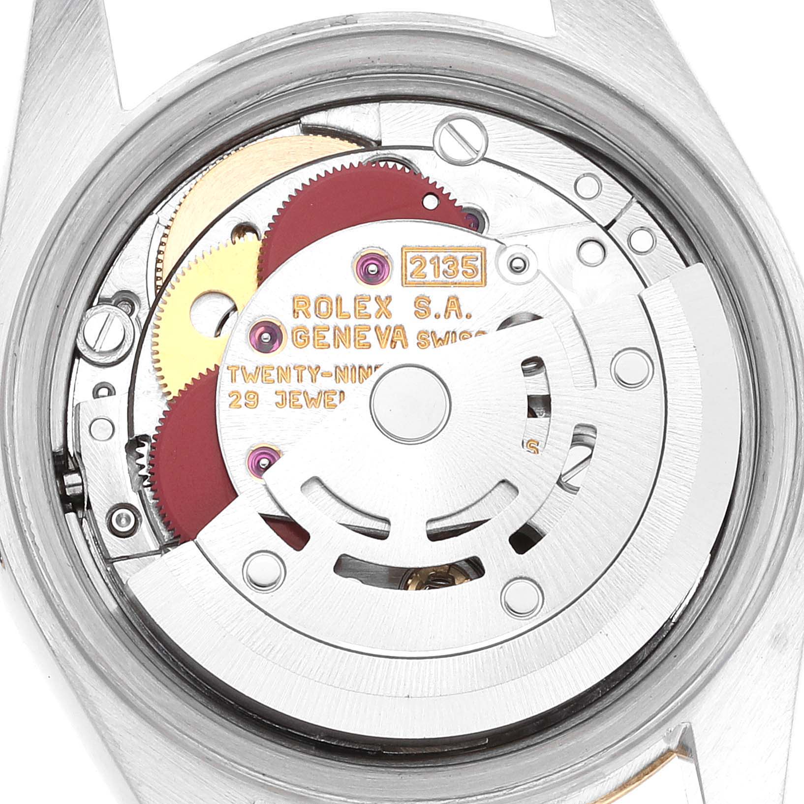 The image shows the inner mechanical components of a Rolex Datejust 69173 Women's Steel and Gold (two tone) Champagne Dial 69173 Women's Steel and Gold (two tone) Champagne Dial watch, including gears and the rotor.