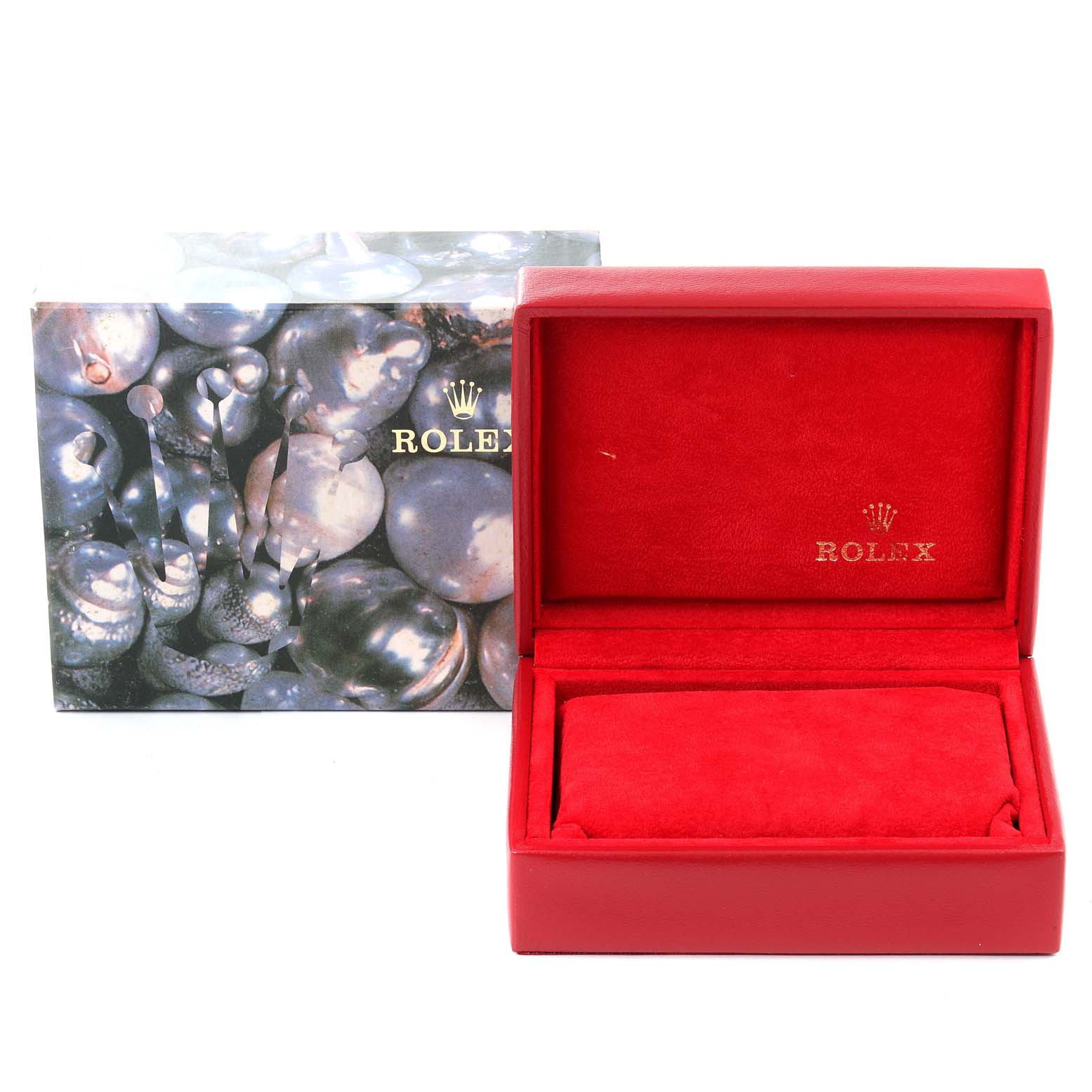 This image shows an open Rolex Datejust 79173 Women's Steel and Gold (two tone) Champagne Dial 79173 Women's Steel and Gold (two tone) Champagne Dial watch box with a red interior and a decorative outer box.