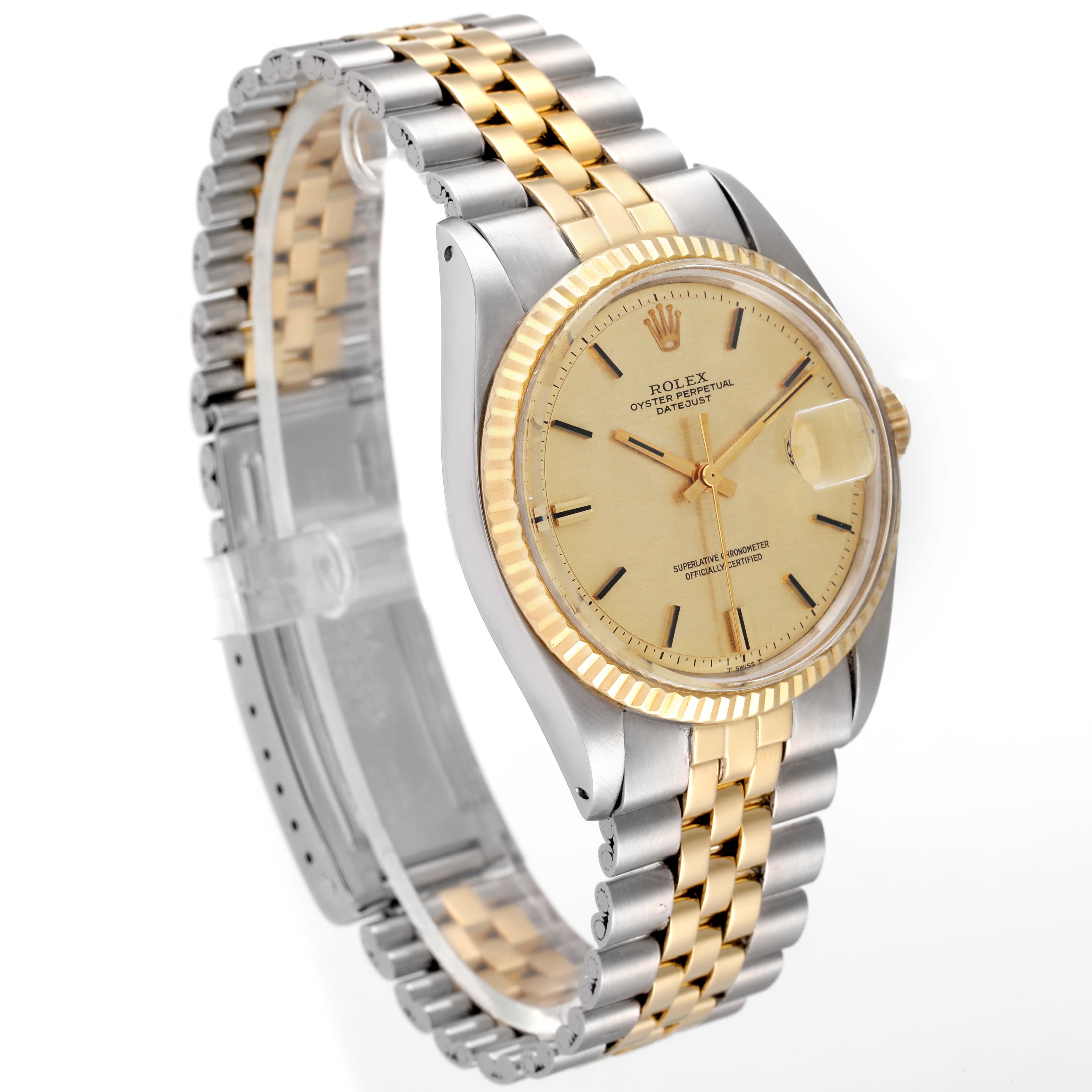 This image shows a side angle view of the Rolex Vintage Collection 1601 Men's Steel and Gold (two tone) Champagne Dial 1601 Men's Steel and Gold (two tone) Champagne Dial watch, highlighting its gold and silver bracelet and champagne dial.