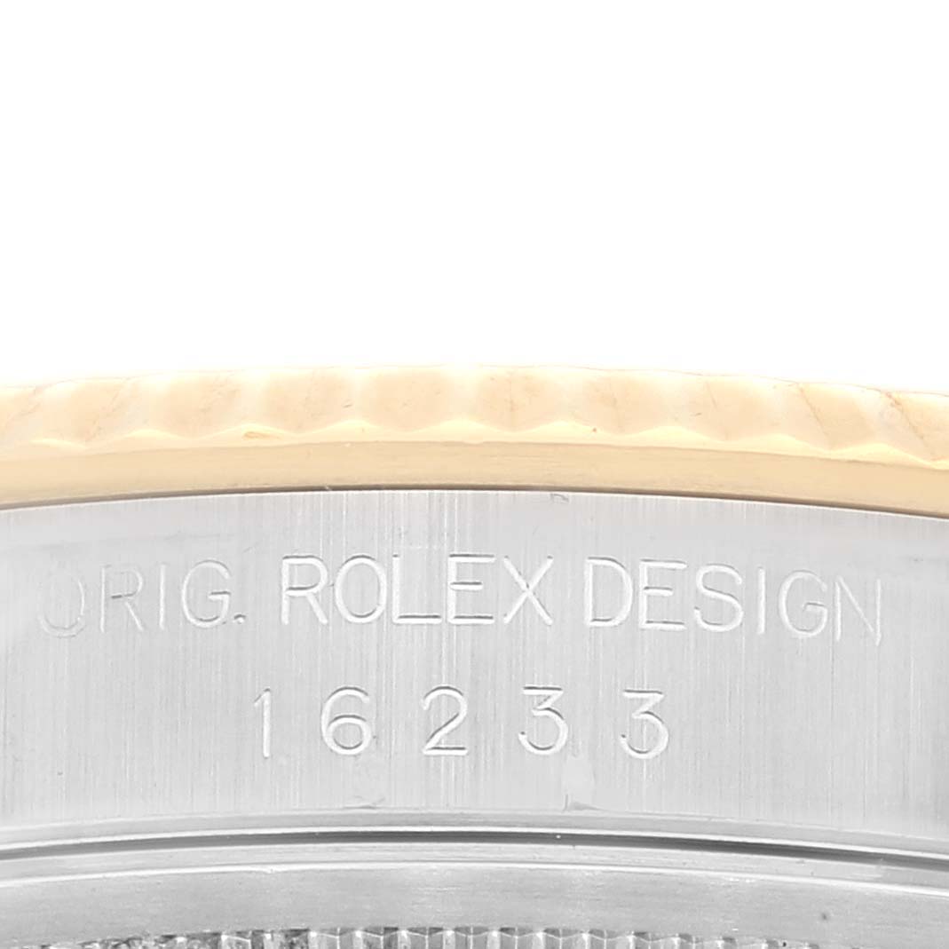 The image shows a close-up of the side of the Rolex Datejust 16233 Men's Steel and Gold (two tone) Mother of Pearl Dial 16233 Men's Steel and Gold (two tone) Mother of Pearl Dial watch, highlighting the engraved model number and brand name.