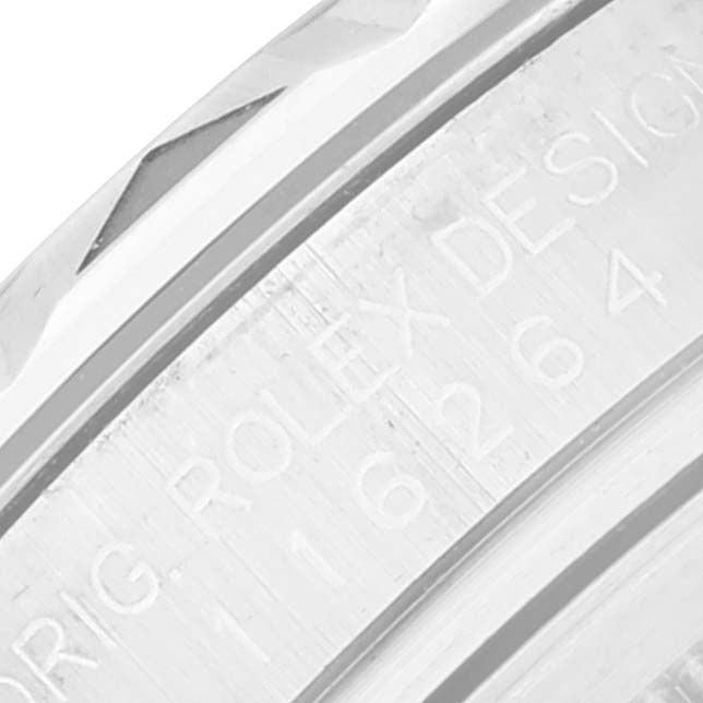 This image shows a close-up of the engravings on the bezel of a Rolex Turn-o-Graph 116264 Men's Stainless Steel Black Dial 116264 Men's Stainless Steel Black Dial watch.