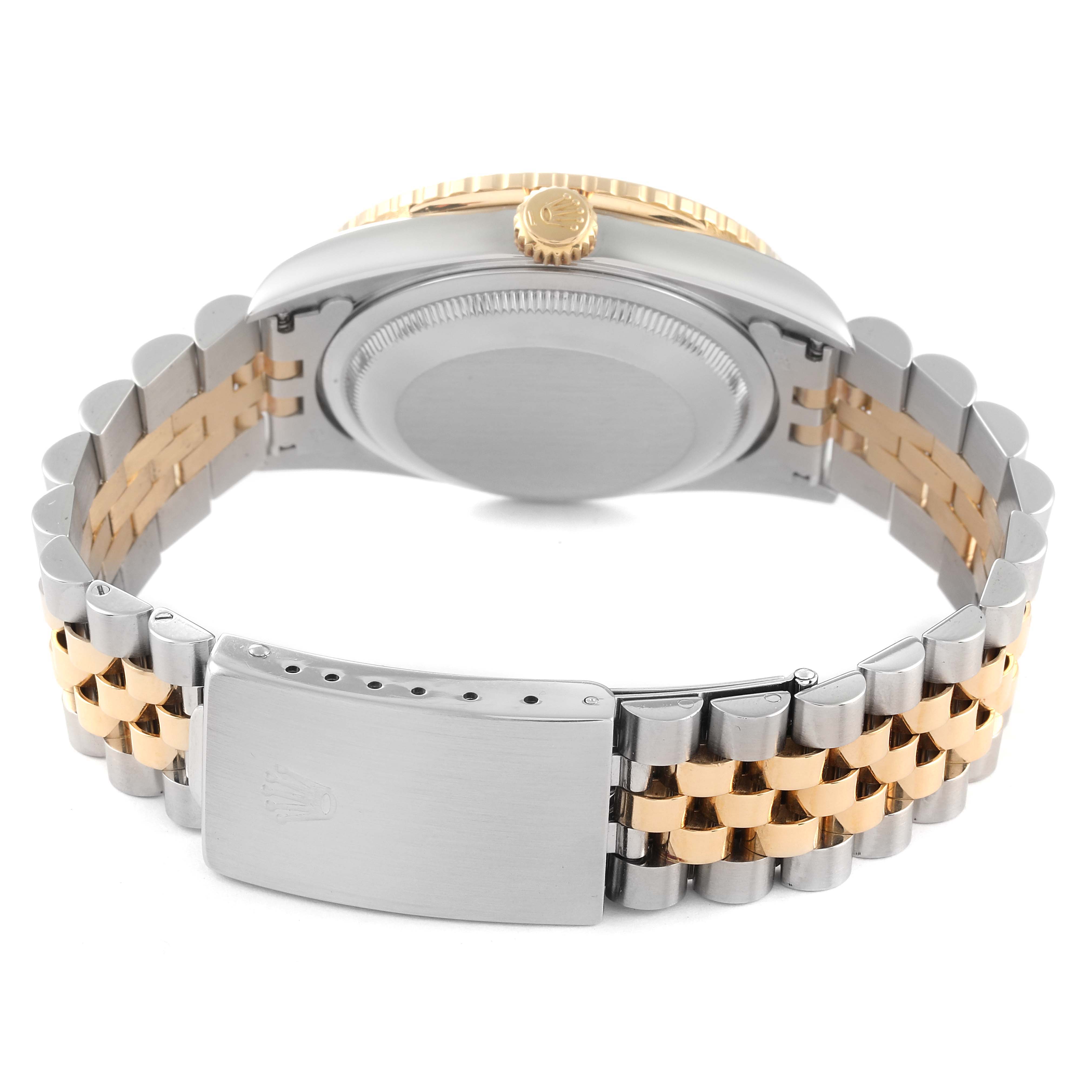 This Rolex Turn-o-Graph 16263 Men
s Steel and Gold (two tone) Champagne Dial 16263 Men
s Steel and Gold (two tone) Champagne Dial model is shown from the rear, displaying the case back, bezel, crown, and the two-tone metal bracelet.