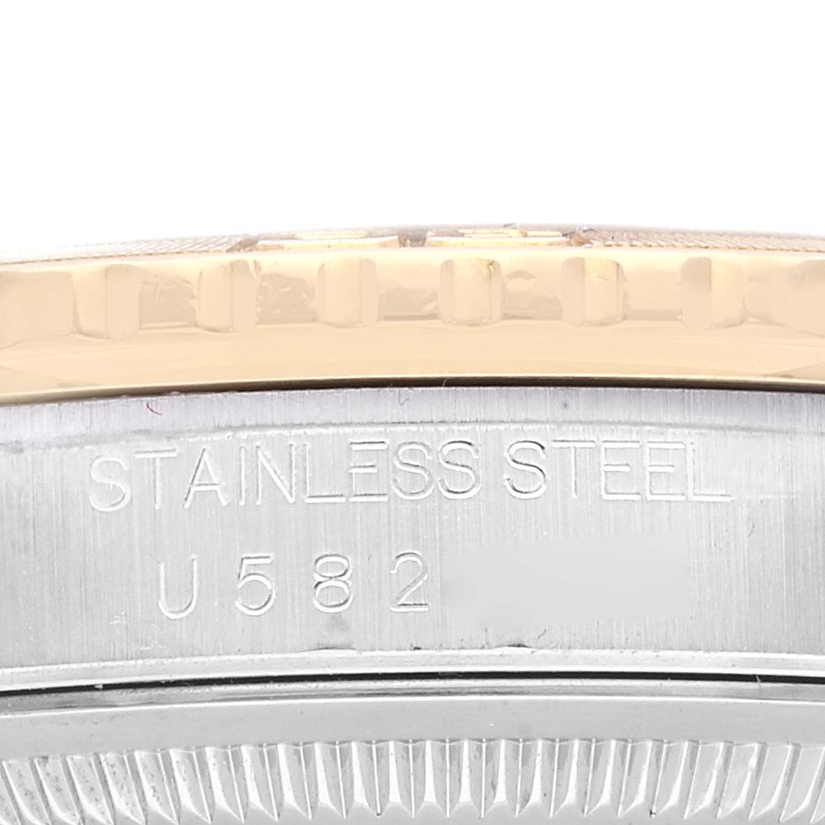 This close-up image shows the edge of the bezel and side engraving of the Rolex Turn-o-Graph 16263 Men
s Steel and Gold (two tone) Champagne Dial 16263 Men
s Steel and Gold (two tone) Champagne Dial watch.