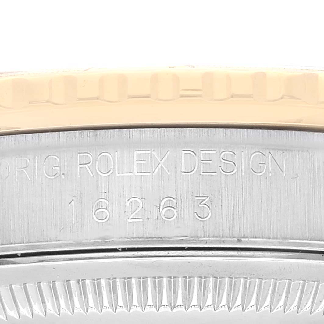 The image shows a close-up of the Rolex Turn-o-Graph 16263 Men
s Steel and Gold (two tone) Champagne Dial 16263 Men
s Steel and Gold (two tone) Champagne Dial model
s engraved case side, including the model number 16263.