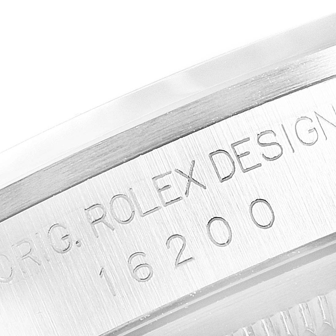 This image shows a close-up of the watch case for a Rolex Datejust 16200 Men
s Stainless Steel White Dial 16200 Men
s Stainless Steel White Dial, displaying the engraved model number and "ROLEX DESIGN."