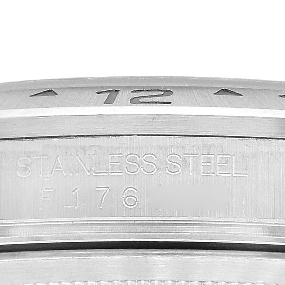 The image shows a close-up angle of the bezel and case of a Rolex Explorer 16570 Men
s Stainless Steel White Dial 16570 Men
s Stainless Steel White Dial, highlighting the "Stainless Steel" engraving.