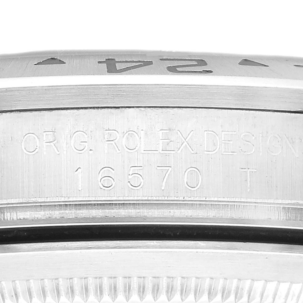 The image shows a close-up of the side of a Rolex Explorer 16570 Men
s Stainless Steel Black Dial 16570 Men
s Stainless Steel Black Dial watch, highlighting the model number "16570" inscribed on the case.