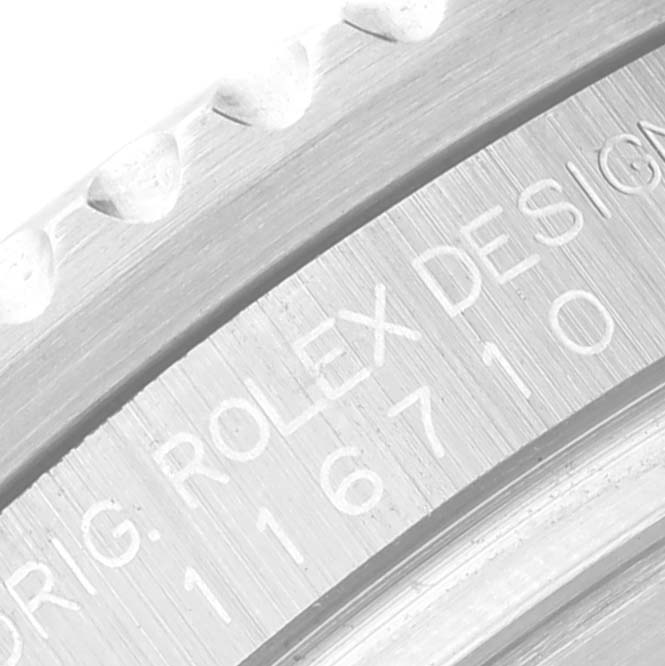 The image shows a close-up of the case and serial number engraving on a Rolex GMT-Master 116710 Men
s Stainless Steel Black Dial 116710 Men
s Stainless Steel Black Dial watch.