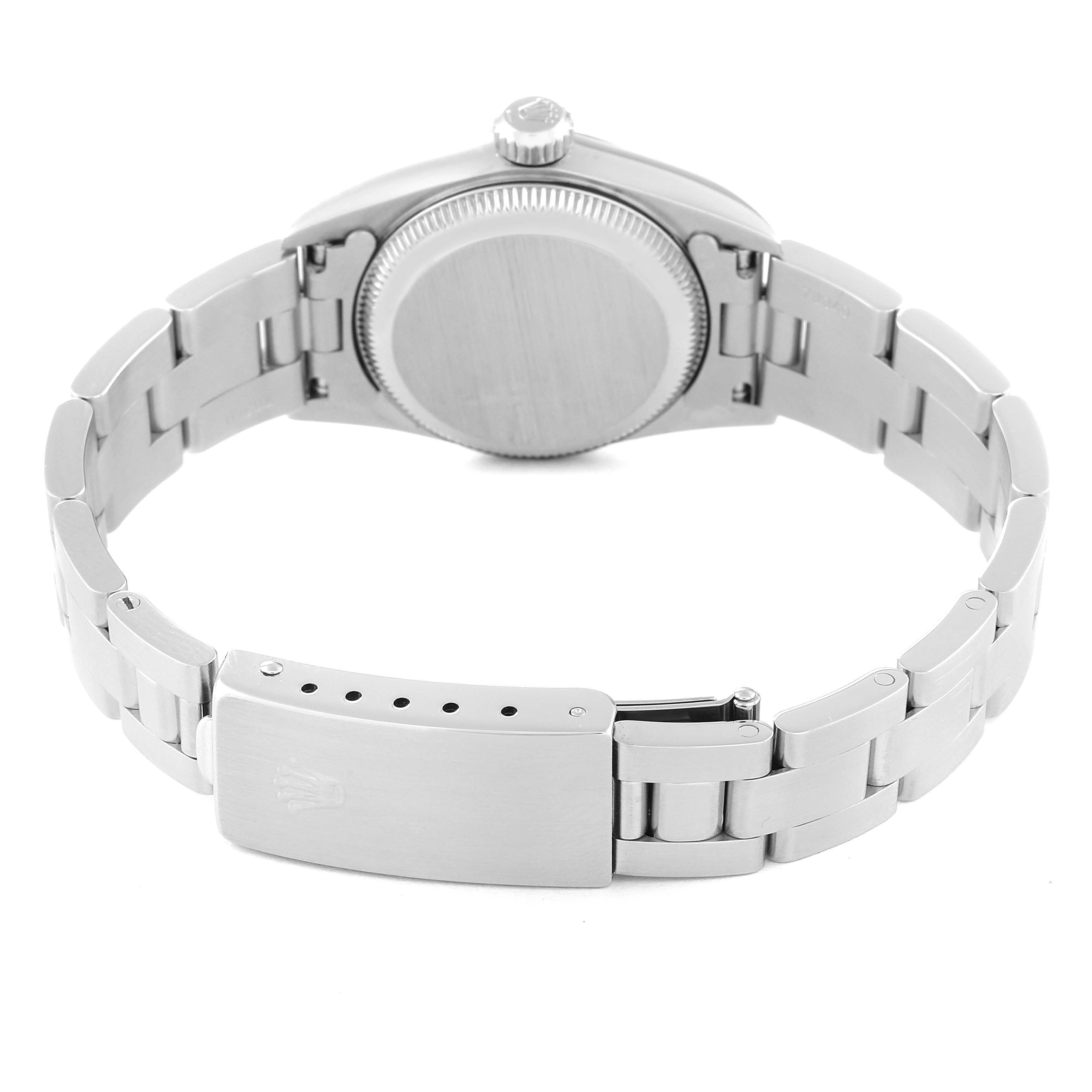 A Rolex Oyster Perpetual 67180 Women's Stainless Steel Black Dial 67180 Women's Stainless Steel Black Dial watch is shown from the rear, highlighting the caseback, crown, and bracelet with clasp.