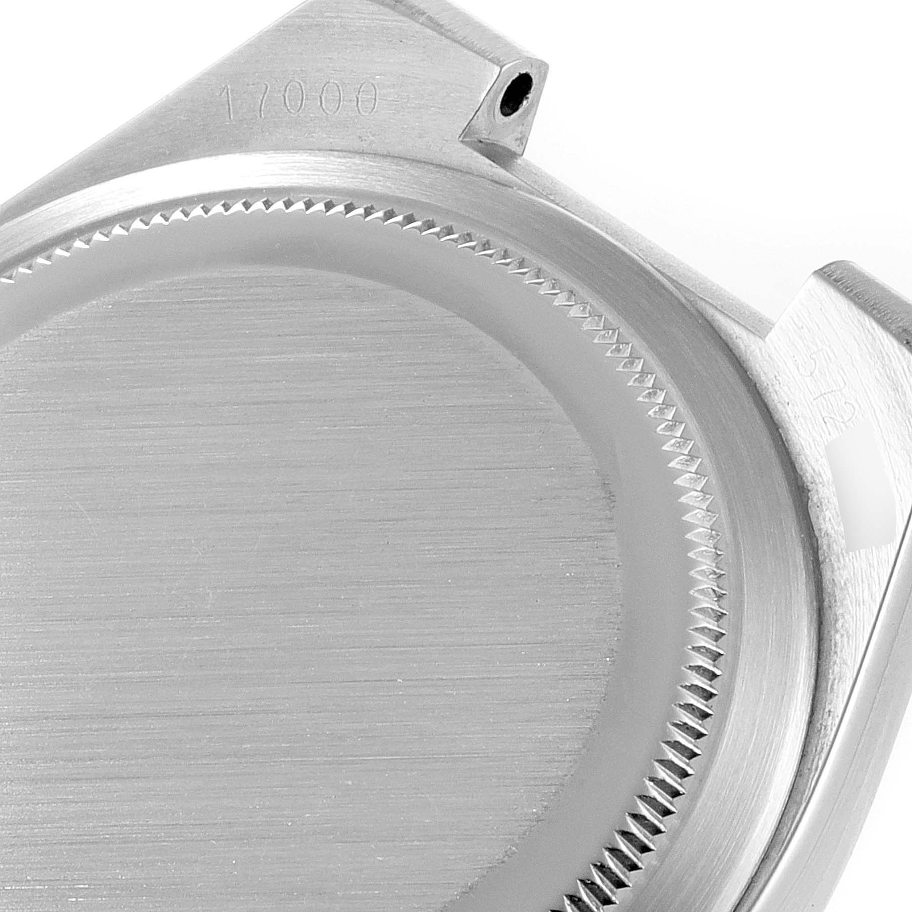 This image shows the back case and part of the lug of a Rolex Oysterquartz 17000 Men's Stainless Steel Silver Dial 17000 Men's Stainless Steel Silver Dial watch model 17000.