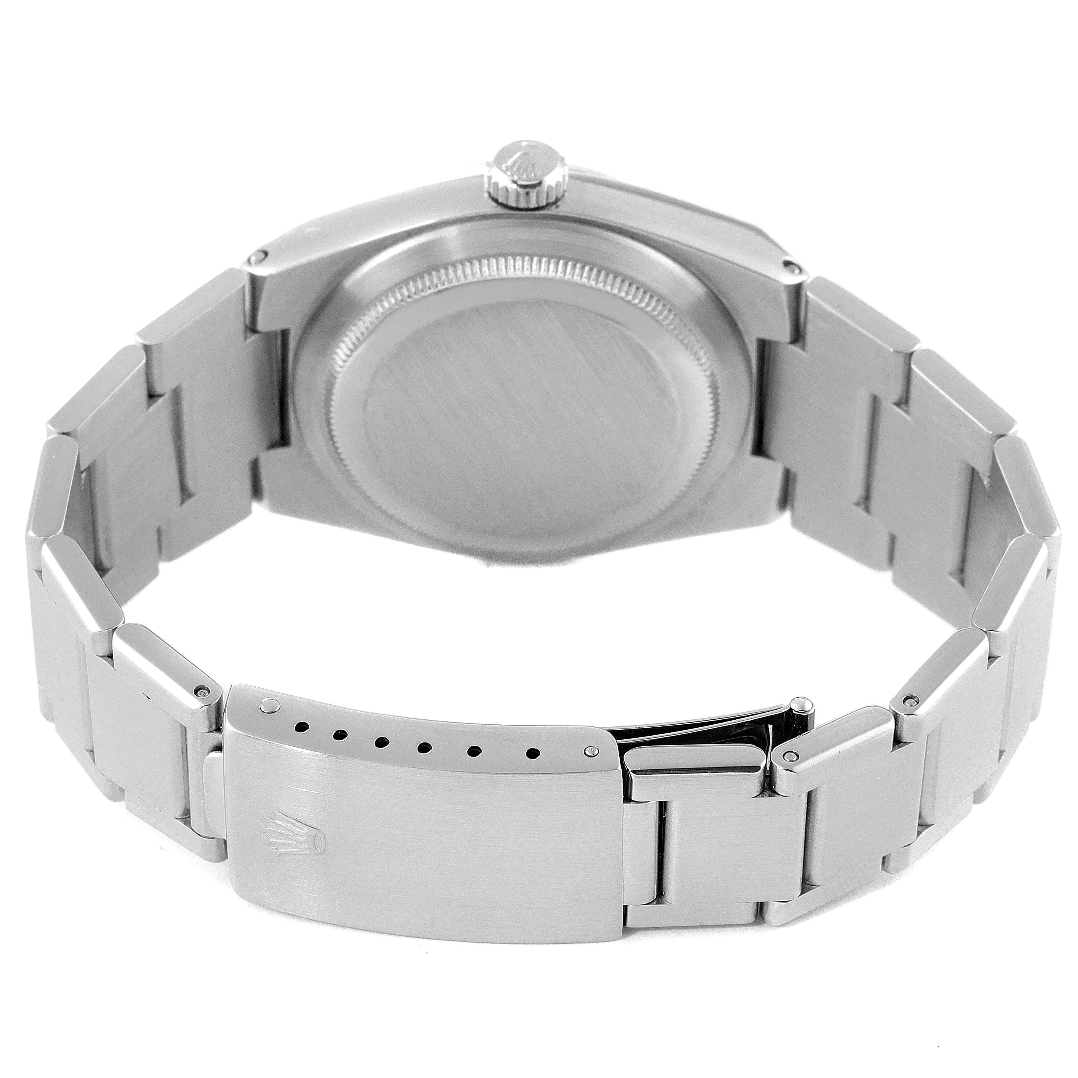 This Rolex Oysterquartz 17000 Men's Stainless Steel Silver Dial 17000 Men's Stainless Steel Silver Dial watch is shown from the back, displaying the case back, crown, and bracelet with the clasp partially open.