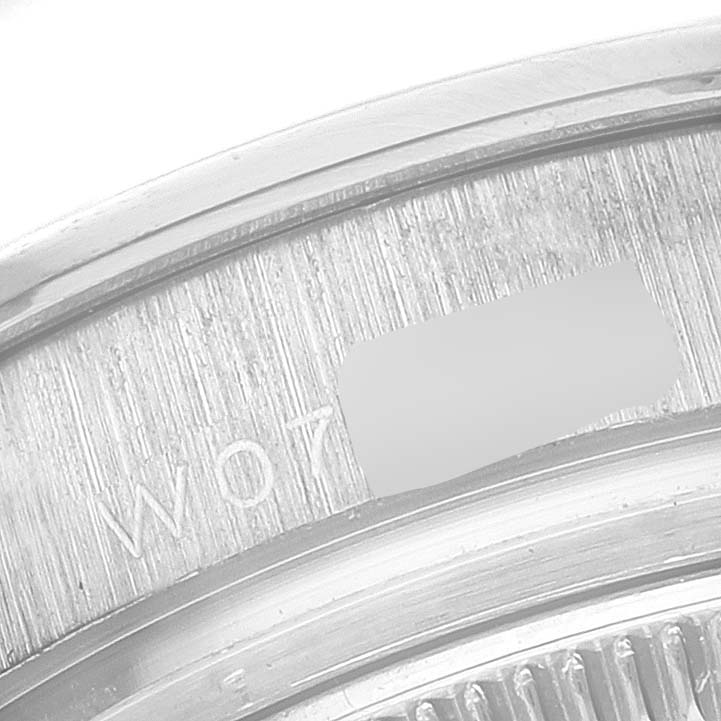 The image shows a close-up of the case back and edge markings of the Rolex Pearlmaster 69299 Women's White Gold Mother of Pearl Dial 69299 Women's White Gold Mother of Pearl Dial watch.