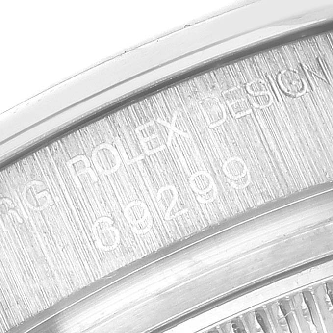 This close-up image shows the engraved model details on the side of a Rolex Pearlmaster 69299 Women's White Gold Mother of Pearl Dial 69299 Women's White Gold Mother of Pearl Dial watch case.