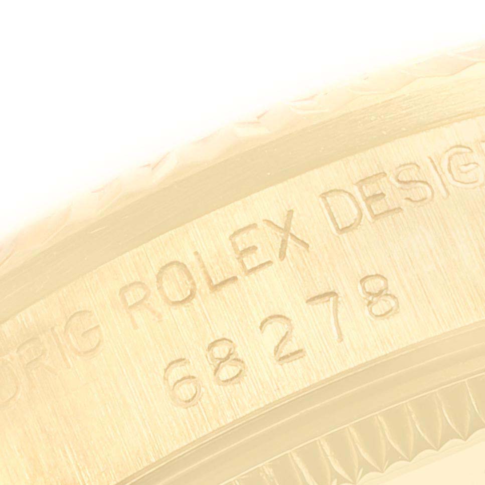 This image shows a close-up of the engraved side of a Rolex President 68278 Women
s Yellow Gold Champagne Dial 68278 Women
s Yellow Gold Champagne Dial model watch.