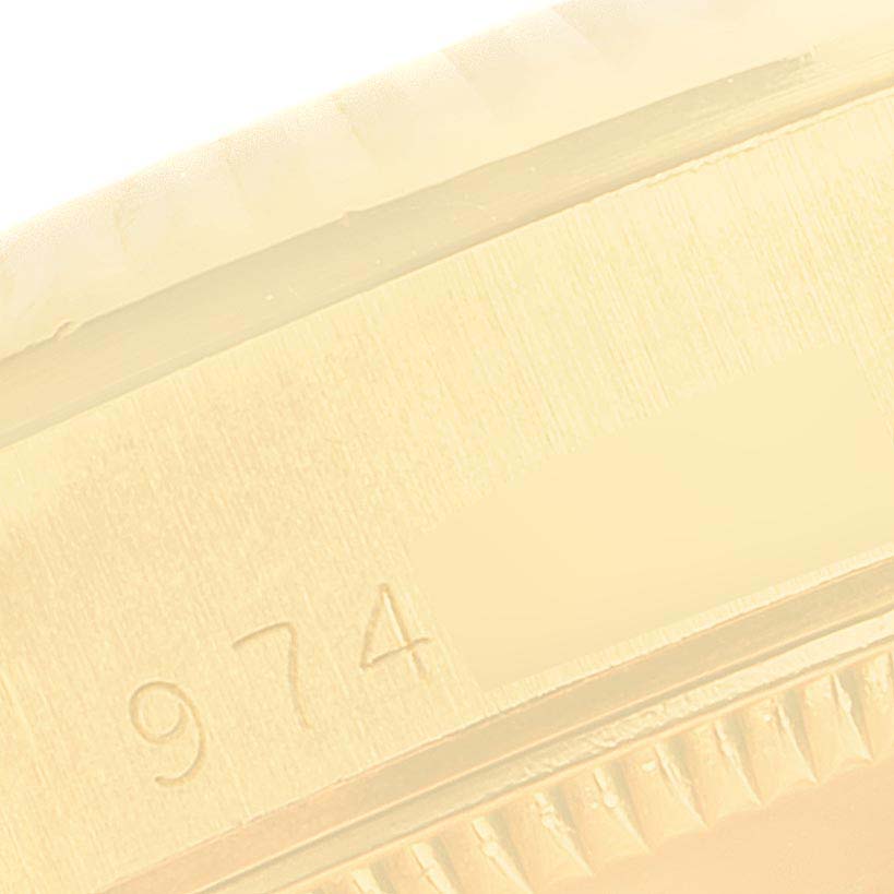 This close-up image shows a portion of the case back and edge details of a Rolex President 68278 Women
s Yellow Gold Champagne Dial 68278 Women
s Yellow Gold Champagne Dial watch.