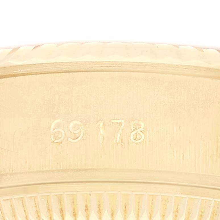This image shows a close-up of the model number "69178" engraved on the side of a Rolex President 69178 Women
s Yellow Gold Champagne Dial 69178 Women
s Yellow Gold Champagne Dial watch.