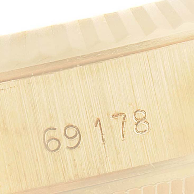 This close-up image shows the engraved model number "69178" on the side of the Rolex President 69178 Women
s Yellow Gold Champagne Dial 69178 Women
s Yellow Gold Champagne Dial watch case.