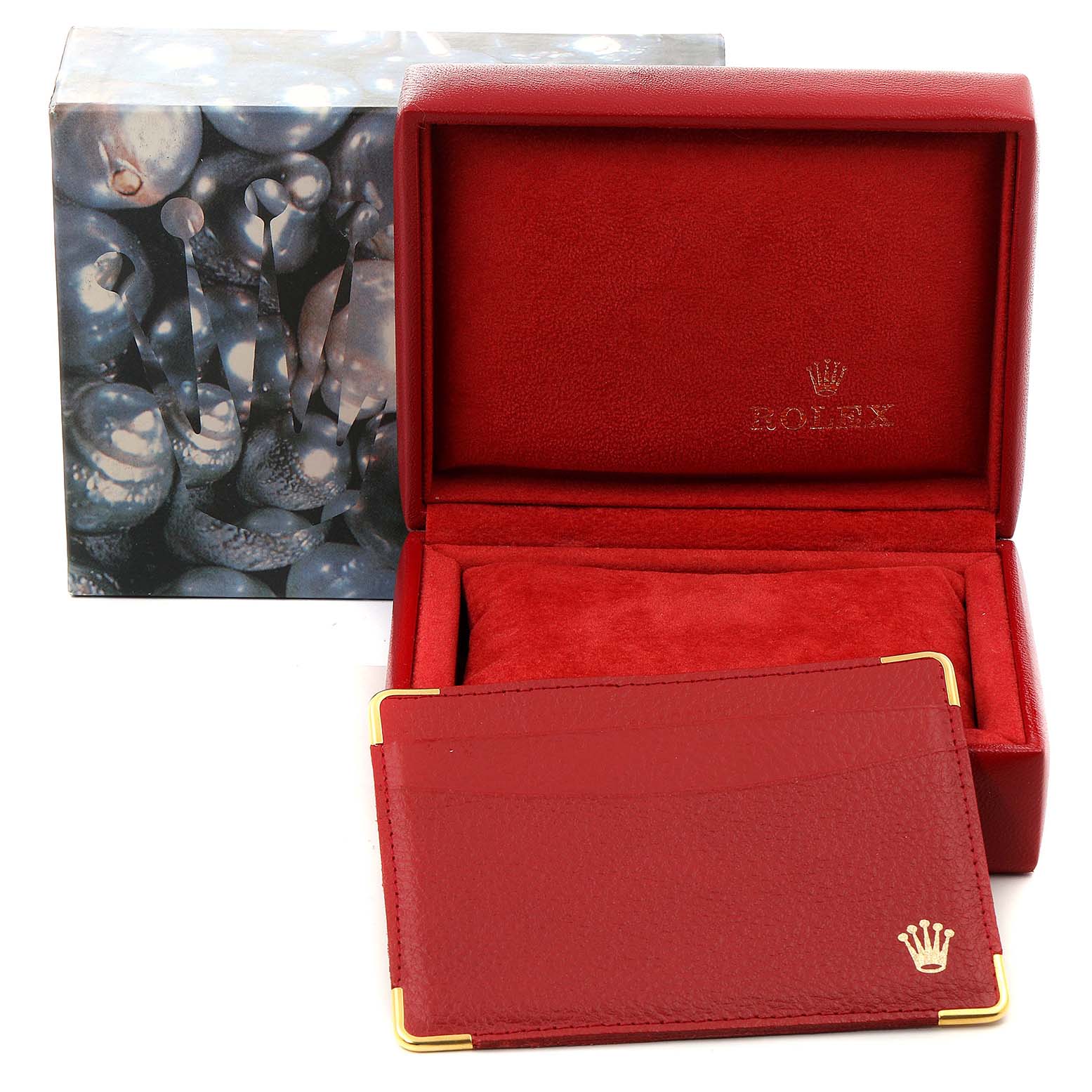 The image shows an open red Rolex box and accompanying card case for the President model watch.