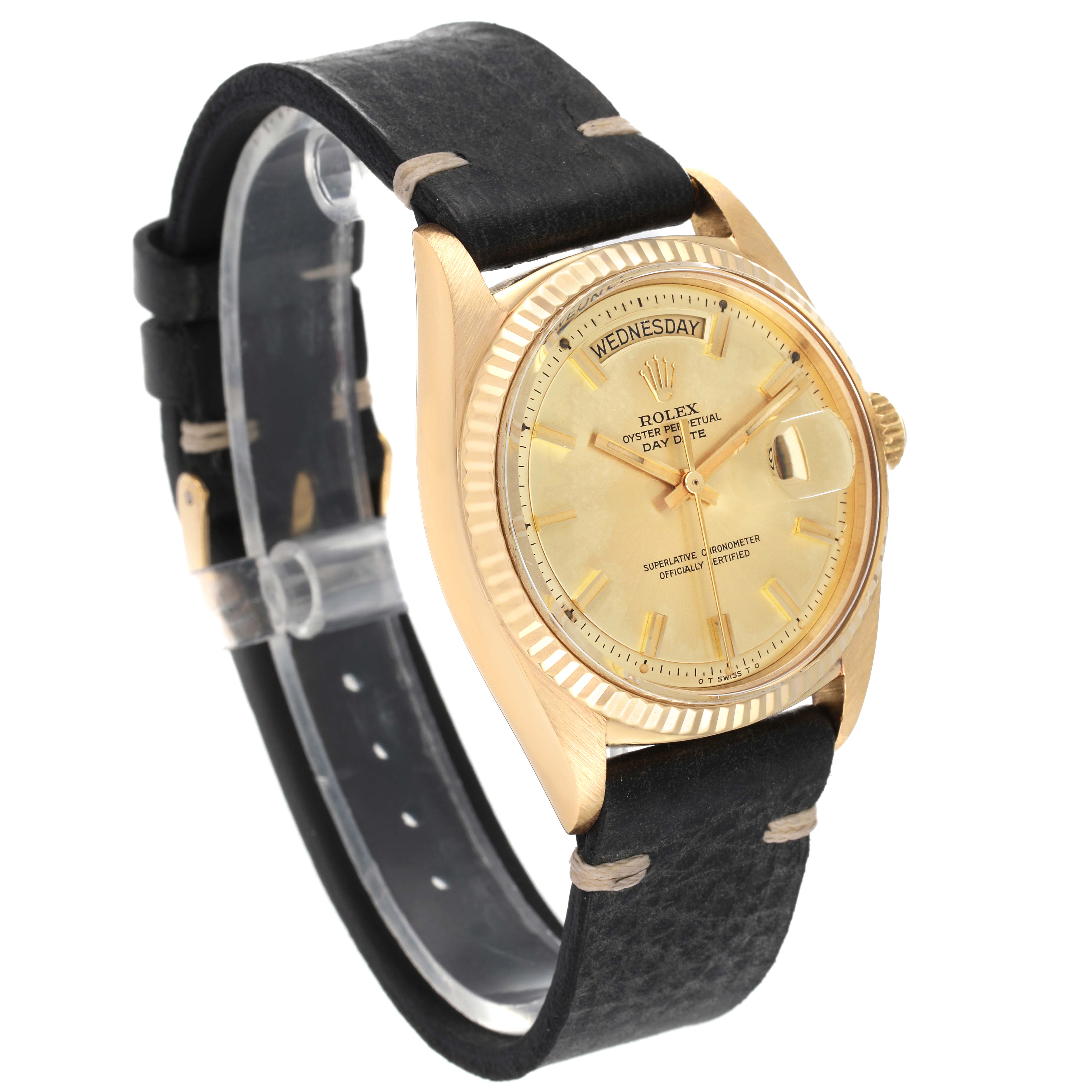 The Rolex Vintage Collection 1803 Men's Yellow Gold Champagne Dial 1803 Men's Yellow Gold Champagne Dial watch is shown at a three-quarter angle highlighting its black strap, gold case, and dial.