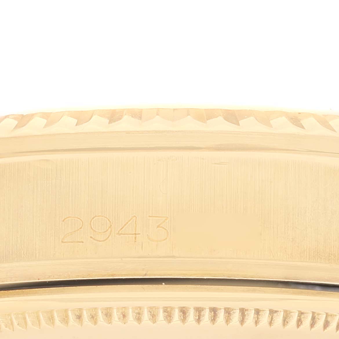 This image shows a close-up of the side view and serial number engraving on the bezel of the Rolex Vintage Collection 1803 Men's Yellow Gold Champagne Dial 1803 Men's Yellow Gold Champagne Dial watch model.