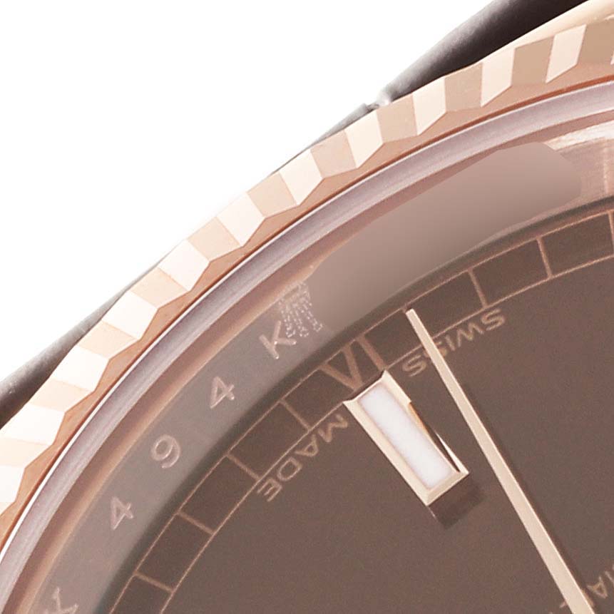 The image shows a close-up of the bezel and dial of a Rolex President 118135 Men's Rose Gold Brown Dial 118135 Men's Rose Gold Brown Dial watch.