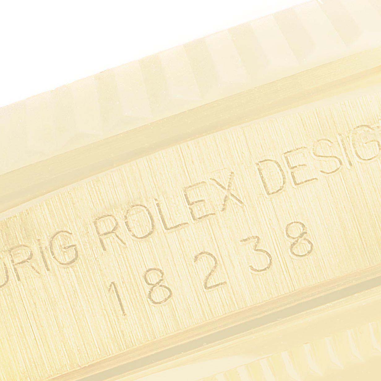 This close-up image shows the engraved reference number on the side of a Rolex President 18238 Men
s Yellow Gold Champagne Dial 18238 Men
s Yellow Gold Champagne Dial model watch.