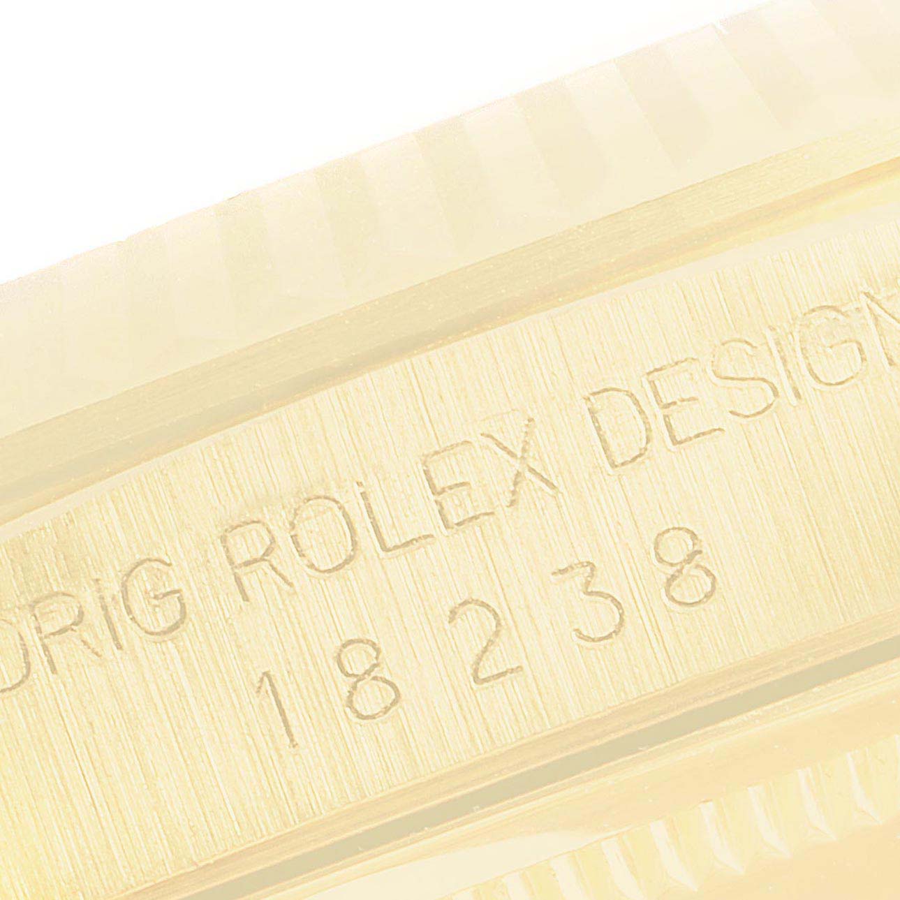 The image shows a close-up of the engraved side of the Rolex President 18238 Men's Yellow Gold Blue Dial 18238 Men's Yellow Gold Blue Dial watch, featuring the model number 18238.