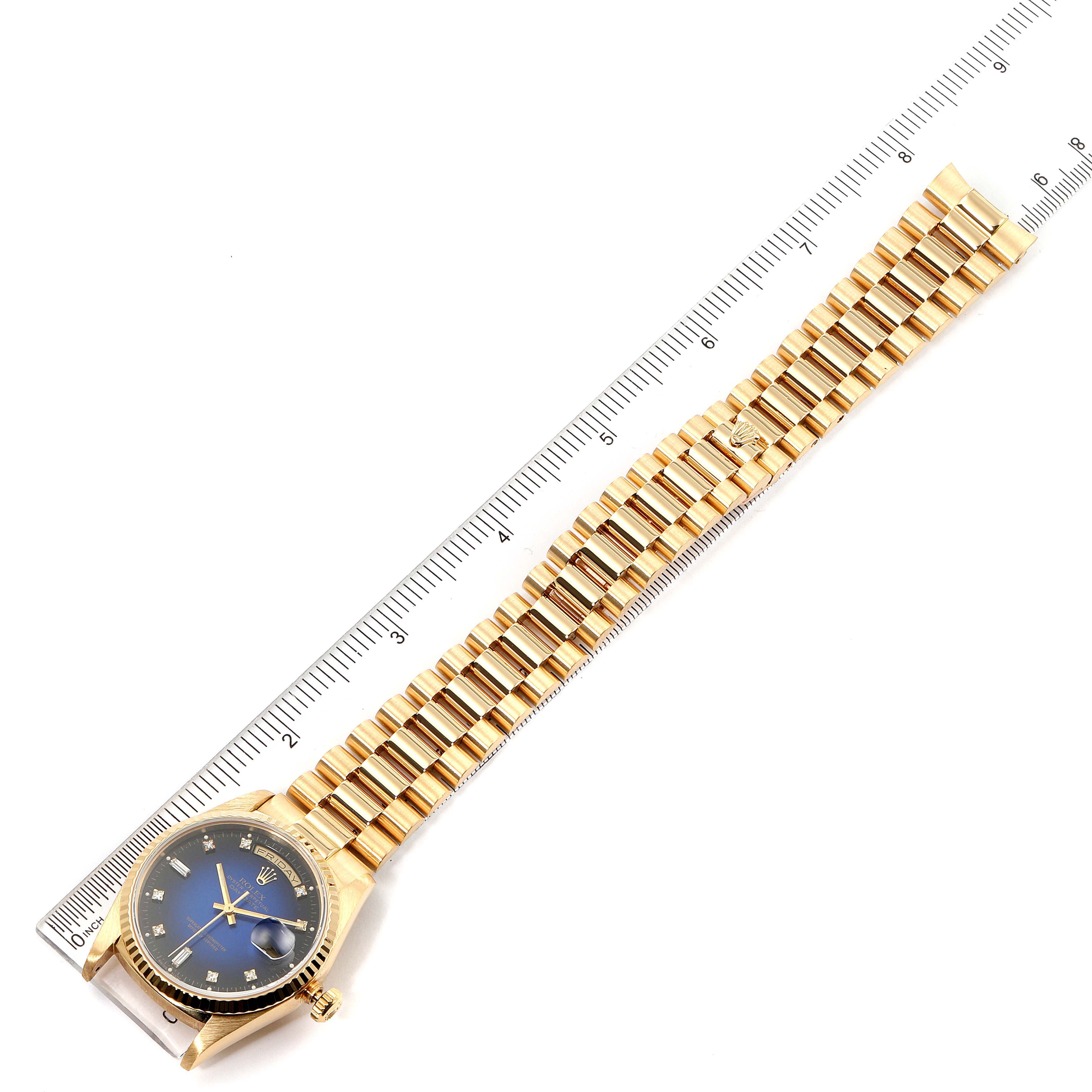 The image shows a Rolex President 18238 Men's Yellow Gold Blue Dial 18238 Men's Yellow Gold Blue Dial watch laid flat with a ruler, displaying the watch head and full bracelet.