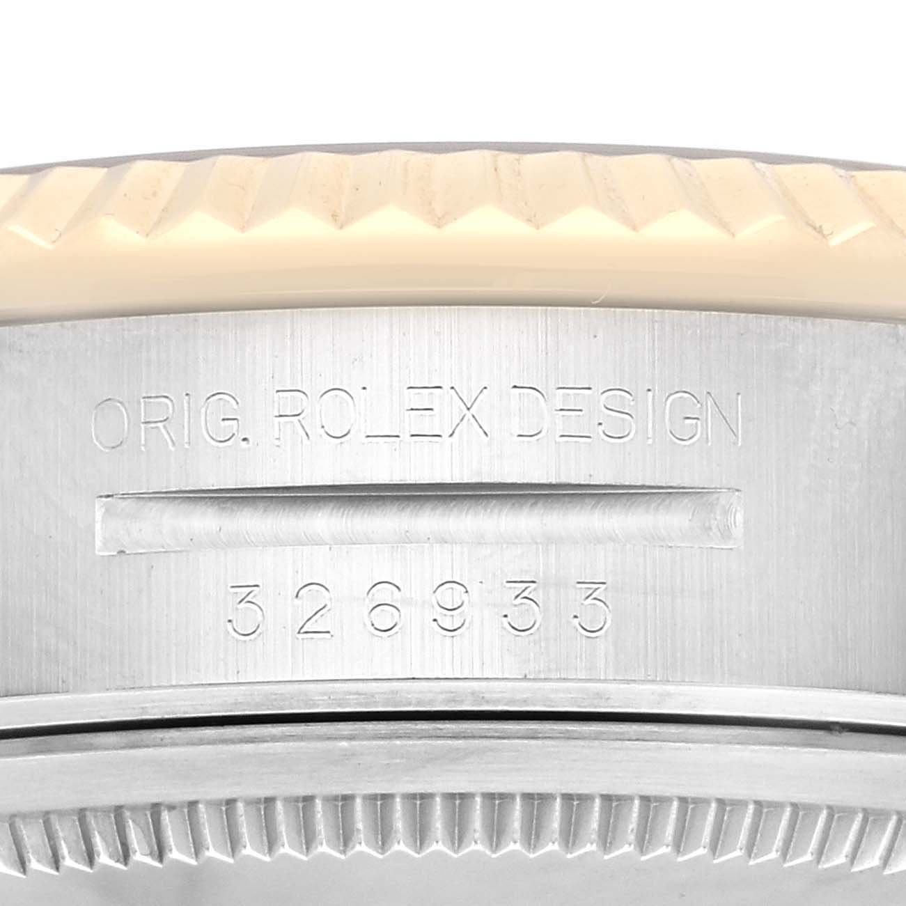 The image shows a close-up view of the bezel and serial number engraving on the Rolex Sky-Dweller 326933 Men
s Steel and Gold (two tone) White Dial 326933 Men
s Steel and Gold (two tone) White Dial watch.