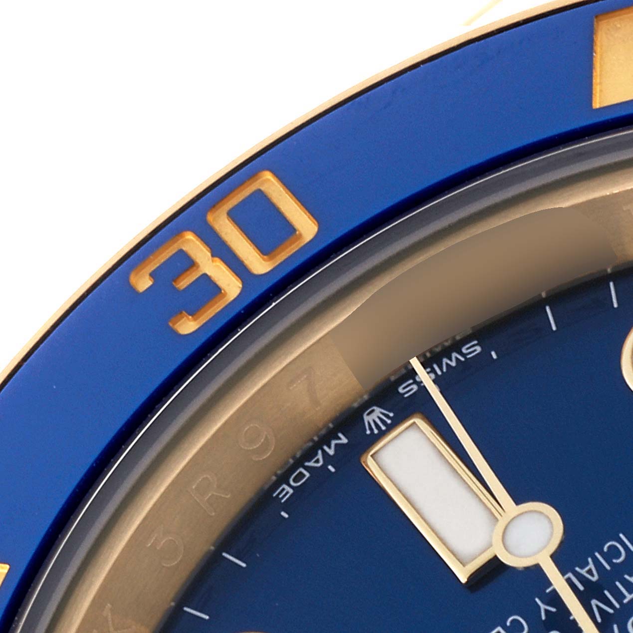 The close-up image shows parts of the dial and bezel of a Rolex Submariner 126618 Men's Yellow Gold Blue Dial 126618 Men's Yellow Gold Blue Dial watch.