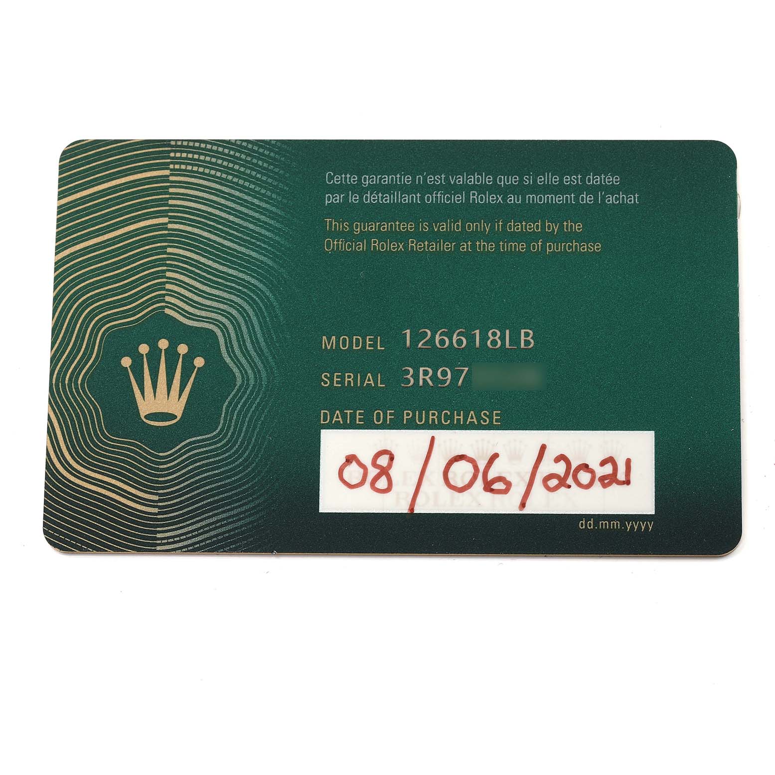 This image shows a warranty card for a Rolex Submariner 126618 Men's Yellow Gold Blue Dial 126618 Men's Yellow Gold Blue Dial model 126618LB, displaying the serial number and date of purchase.