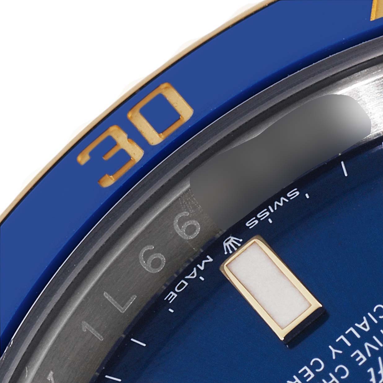 The image shows a close-up of the bezel and part of the dial of a Rolex Submariner 126613 Men's Steel and Gold (two tone) Blue Dial 126613 Men's Steel and Gold (two tone) Blue Dial watch.