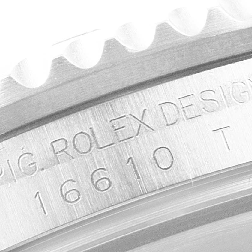 This image shows a close-up of the engraved case side of a Rolex Submariner 16610 Men
s Stainless Steel Black Dial 16610 Men
s Stainless Steel Black Dial watch.