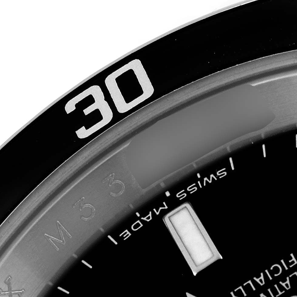The image shows a close-up and partial view of the bezel, dial, and hour markers of a Rolex Submariner 16610 Men
s Stainless Steel Black Dial 16610 Men
s Stainless Steel Black Dial watch.